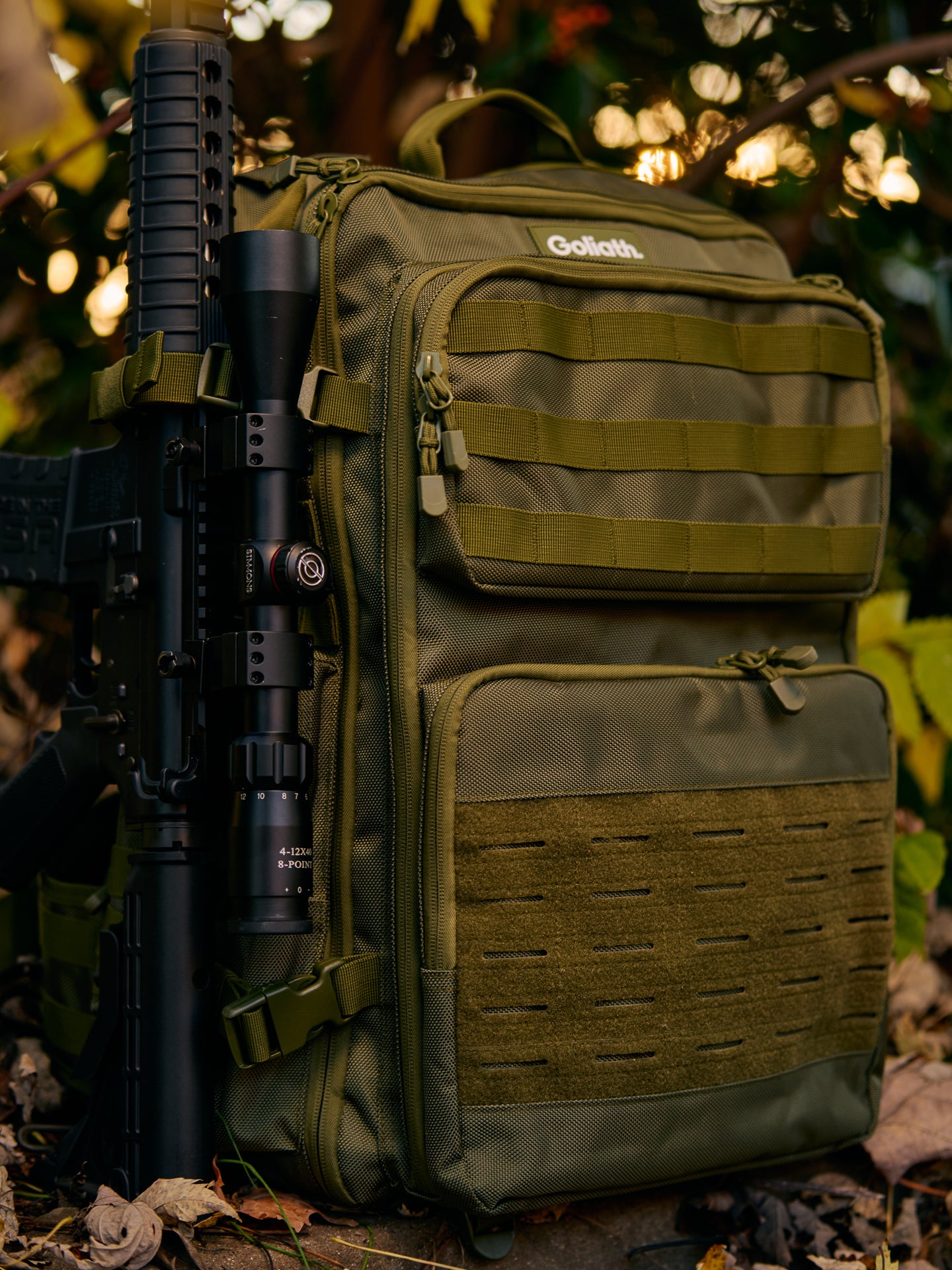 Army green goliath backpack with rifle attached